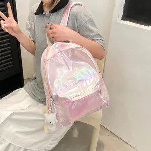 Chic iridescent pink laser backpack for students with a fluffy white bear keychain