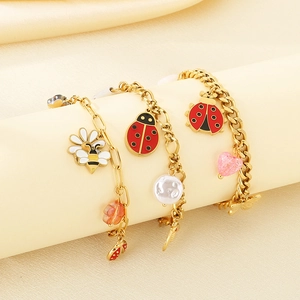 Fashionable gold charm bracelets with enamel bees, ladybugs, pearls and pink hearts