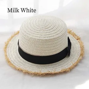 Cream white raffia boater hat with black ribbon bow and frayed edges for summer sun protection