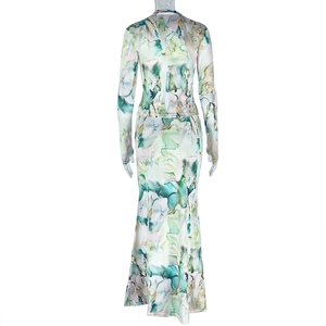 Detail of floor-length dress featuring green blue marble print and silky fabric texture