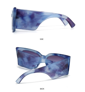 Detailed side and back view of oversized rectangle sunglasses with blue marble pattern