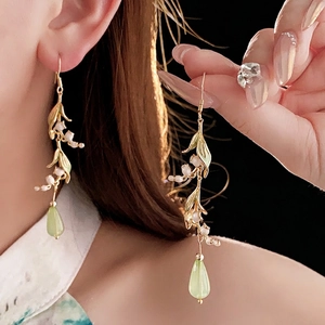 Elegant lily of the valley earrings with gold leaves and green resin water drop pendants