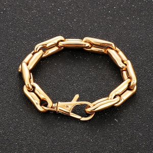 Detailed shot of golden coffee bean link bracelet with secure lobster clasp for men