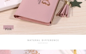 Close-up of pink PU leather wallet featuring metal butterfly and tassel star charm