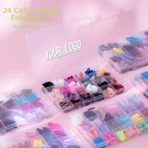 Macro shot of 24-color mixed artificial nail set in clear plastic organizer boxes