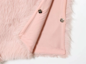 Close-up of pink faux fur vest lining with silver metal snap button fasteners