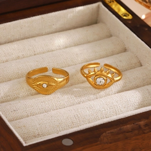 Minimalist evil eye rings set in gold plating with rhinestones and adjustable bands