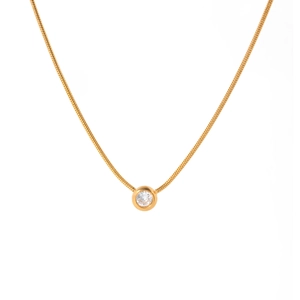 Macro shot of 18K gold snake chain necklace with a bezel-set round clear crystal pendant