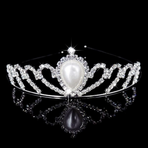 Elegant silver bridal tiara with pear-shaped pearls and sparkling rhinestones on mirror base