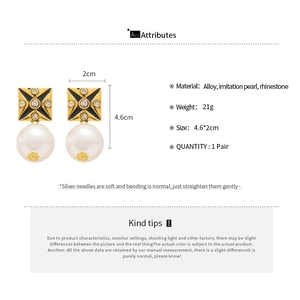 Detail view of retro square earrings showing dimensions and large faux pearl drop