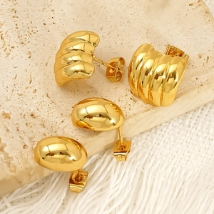 Gold plated stainless steel earring set featuring ribbed hoop and smooth dome designs