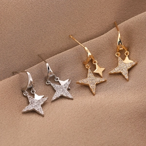 Star-shaped S925 silver stud earrings with sparkling cubic zirconia in gold and silver
