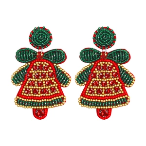 Detailed macro shot of handmade beaded Christmas bell earrings with red and green seed beads