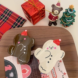 Cute gingerbread man hair claws in chocolate and cream white for Christmas hairstyling
