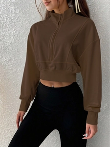 Women's brown cropped quarter-zip sweatshirt with a stand collar in a vintage casual style