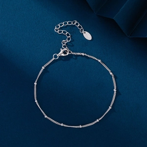 Elegant S925 sterling silver beaded bracelet with adjustable lobster clasp on blue base
