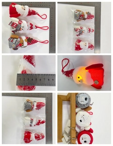 Detail view of plush Christmas ornaments with LED lights, showing Santa and Reindeer figures