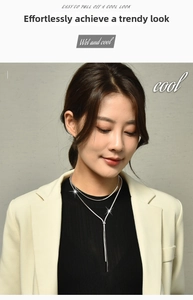 Silver snake bone chain Y-necklace with tassel detail on professional model