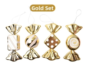 Macro detail of four gold plated candy ornaments with white festive patterns for Christmas tree