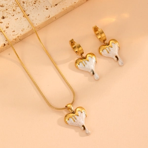 Melting white enamel heart pendant necklace and earring set in gold-plated stainless steel