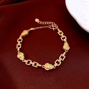 24K gold plated beaded flower bracelet with a gourd pendant on red velvet background