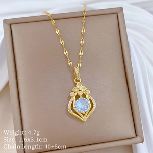 Detailed view of teardrop pendant with large round stone and small diamonds in a box