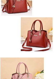Detailed view of red and pink PU leather handbags featuring cherry charms and metal handles