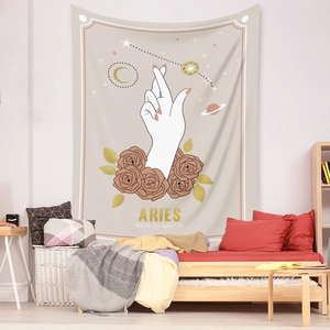 Detail of Aries constellation tapestry with white hand gesture and roses in bedroom decor