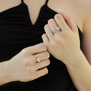 Close-up of S925 sterling silver rings with letter N and zircon heart detail