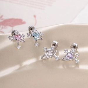 Set of four silver heart zircon earrings in pink, blue, white, and purple on silk background