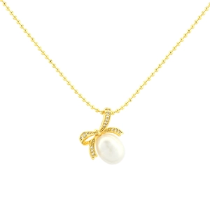 Golden bow necklace with sparkling diamonds and white freshwater pearl on white background