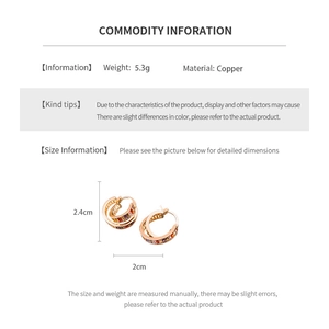 Detail of 5.3g copper hoop earrings featuring colorful cubic zirconia and double ring design