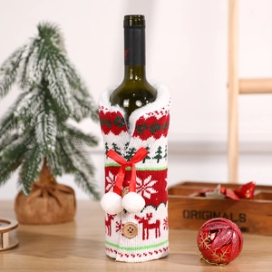 Knitted Christmas wine bottle cover with elk and snowflake patterns and soft pompom decor