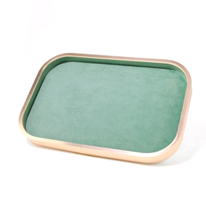 Detail of mint green velvet jewelry tray with champagne gold aluminum metal frame