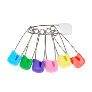 Colorful plastic head baby safety pins in assorted colors on a clean white background