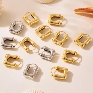 Minimalist U-shaped hollow hoop earrings in polished gold and silver finish