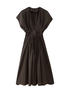 Detail of deep brown V-neck dress featuring a pleated waist and adjustable drawstring