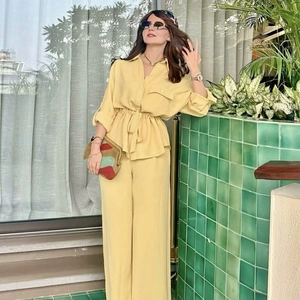 Women's safari style casual two-piece set with yellow long sleeve shirt and wide leg pants
