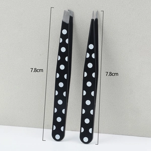 Black polka dot eyebrow tweezers set with slanted and pointed tips, 7.8cm length
