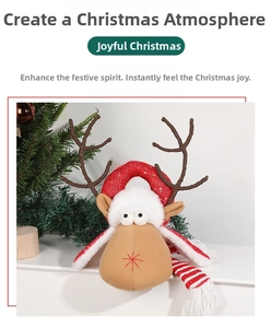 Detail of Christmas reindeer decoration featuring a red striped scarf and shiny red sequins