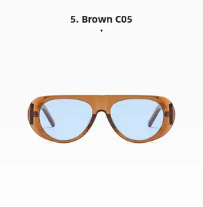 Detail view of large frame amber brown sunglasses with blue tinted lenses and integrated nose pads