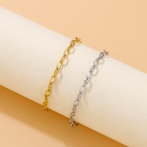 Golden and silver chunky hammered chain necklaces with toggle clasps on white stands