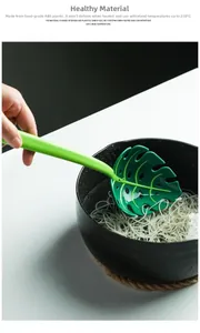 Leaf-shaped kitchen colander straining noodles made of heat-resistant green ABS plastic