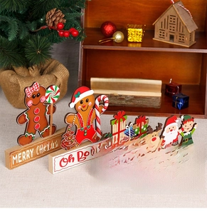 Detailed view of festive wooden Christmas gingerbread man and Santa tabletop decorations