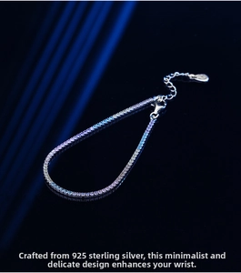 Close-up of 925 sterling silver tennis bracelet with rainbow cubic zirconia and lobster clasp