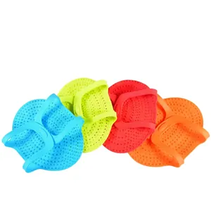 Set of four colorful silicone shark-shaped oven mitts with non-slip texture detail