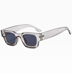 Detail of square semi-rimless sunglasses with translucent grey frames and dark grey lenses