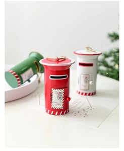Detail of red Christmas metal mailbox ornament with To Santa Claus print and hanging rope