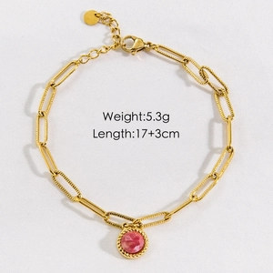 Detail view of gold stainless steel bracelet with pink stone pendant and size specs