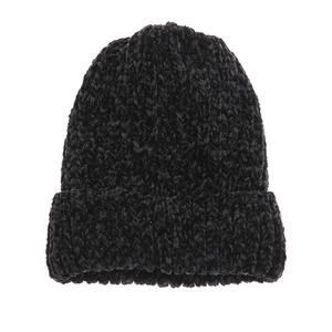 Close-up of black knitted chenille beanie showing soft texture and premium weave pattern